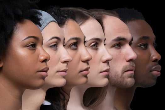 Diverse group of young adults showcasing unique features, representing different backgrounds against a dark backdrop. photo