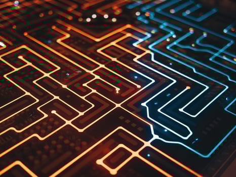 Close-up of an intricate circuit board featuring glowing orange and blue paths, creating a vibrant tech-inspired design. photo