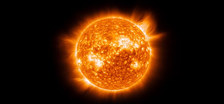Sun surface with intense solar flares and radiation in deep space photo