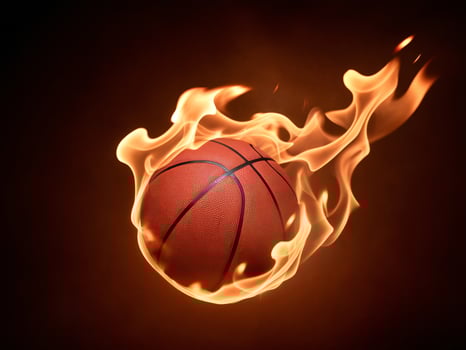 A basketball engulfed in flames, symbolizing intensity and passion for the game. photo