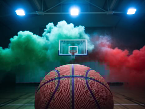 A basketball in focus with colorful smoke in a gym, creating an energetic atmosphere. photo