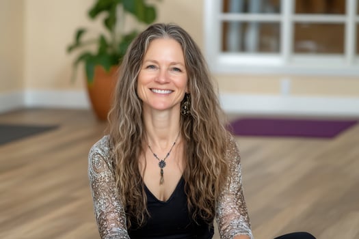 Woman smiling with long wavy hair indoors portrait photo