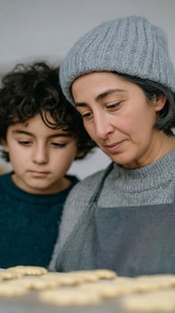 Middle Eastern mother and son, cozy baking, aromatic cookies, culinary bonding, Persian Yalda festival, heartfelt kitchen tradition photo