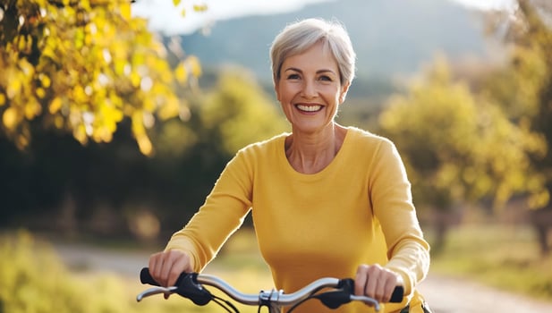 Mature woman cycling outdoors active lifestyle photo