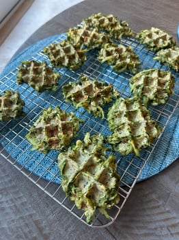 Freshly baked green vegetable zucchini waffles cooling on a wire rack, showcasing healthy and delicious homemade inspiration, concept of breakfast, snack photo