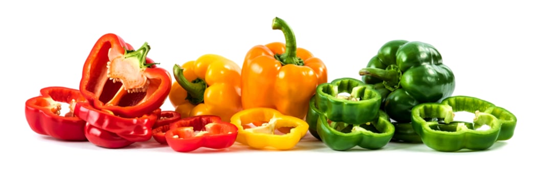 Green yellow red chopped sweet bell pepper isolated on white background photo