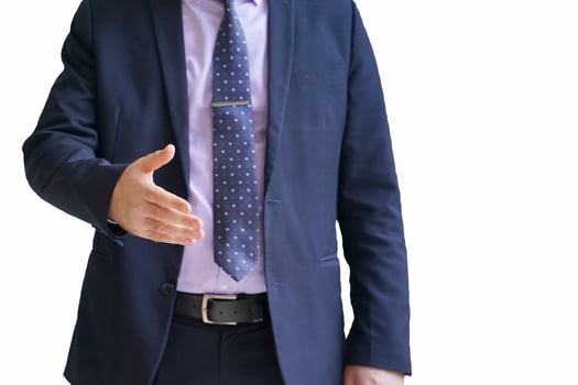 Businessman stretches out his hand on white background photo