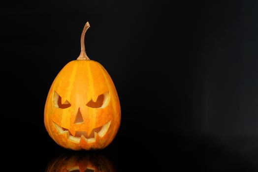 Beautiful halloween gourd on black background photo