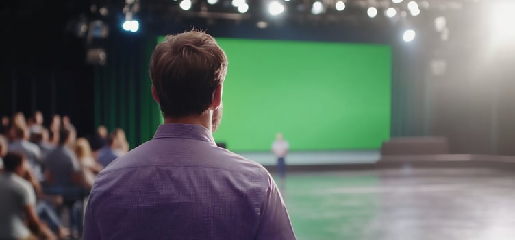 Presentation stage with person watching green screen with audience photo