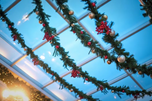 Festive christmas garlands adorn a ceiling with soft lighting photo