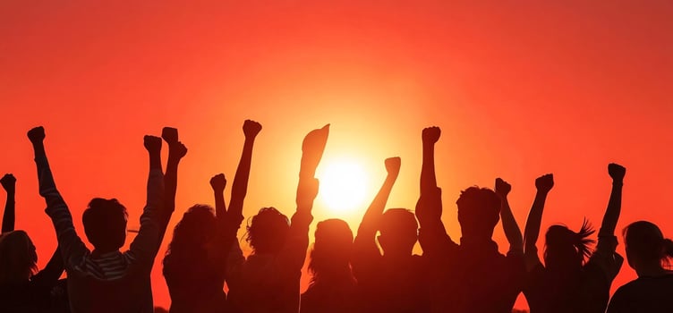 United group silhouette celebrating success at sunset photo