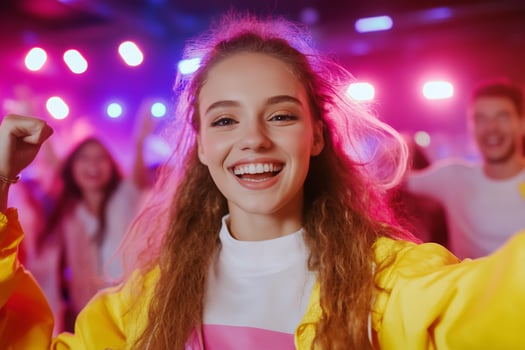 Excited young people celebrate event nightlife with vibrant lights photo