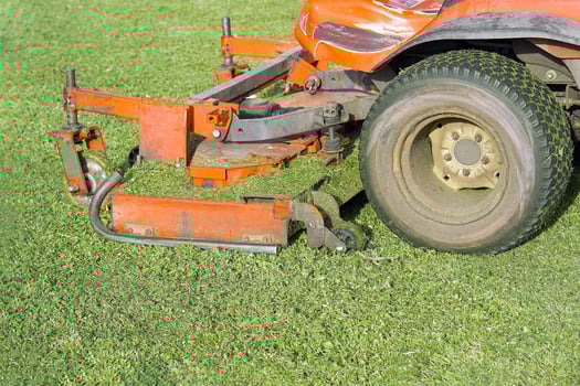 Auto Lawn Mower. Machine mower on a background of green lawn photo