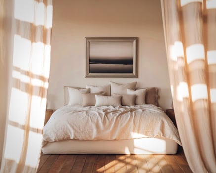 Serene bedroom with natural light and abstract art photo
