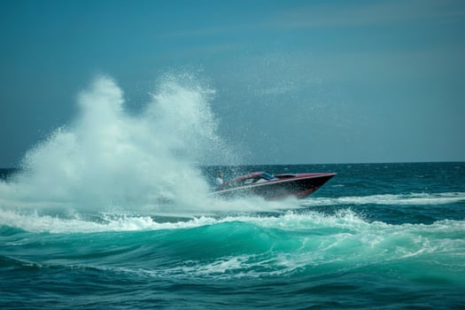 Speedboat creates large splash as it races across the ocean photo