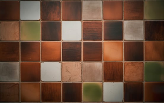 A brown and white tiled wall with squares photo