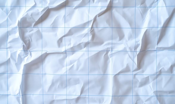 Crumpled white graph paper texture with geometric blue grid lines abstract background photo