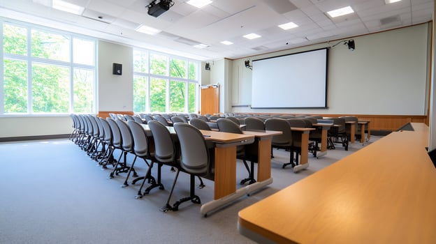 Empty classroom lecture hall with chairs and desks for education or presentation photo