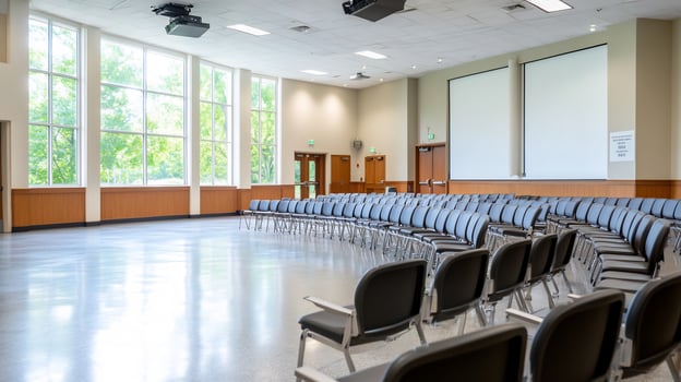 Empty conference room with projectors and seating arrangement for corporate meeting photo