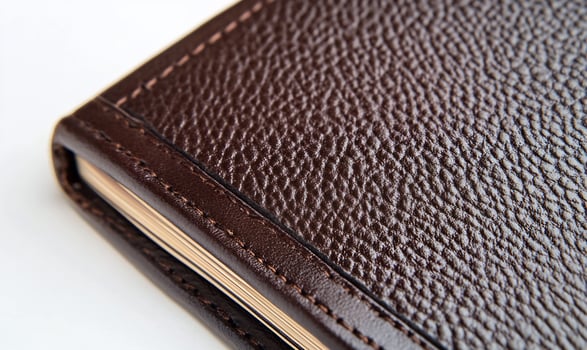 Textured leather book cover with detailed stitching and grain patterns photo