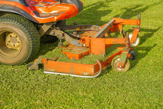 Auto Lawn Mower Machine mower on a background of green lawn photo