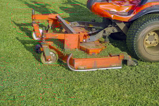 Auto Lawn Moweron a green field photo