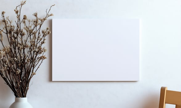 Blank canvas frame with flower vase on wall interior still life mockup background photo