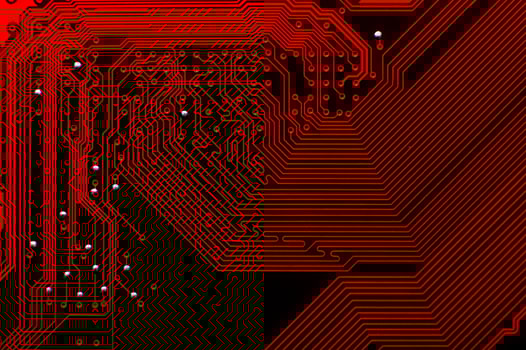 Top view of a computer plate as a background. Macro shot of a printed circuit board, paths are visible in detail. Abstract tech background for advertising photo