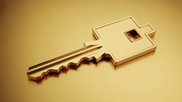 A lustrous gold key resting on a golden surface, symbolizing luxury and exclusivity. photo