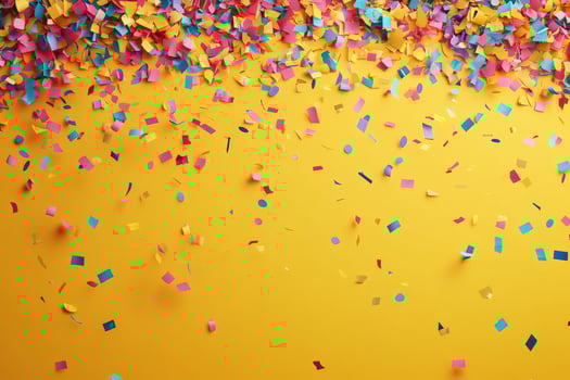 Colorful Confetti Scattered on Bright Yellow Background for Celebration and Festive Events photo