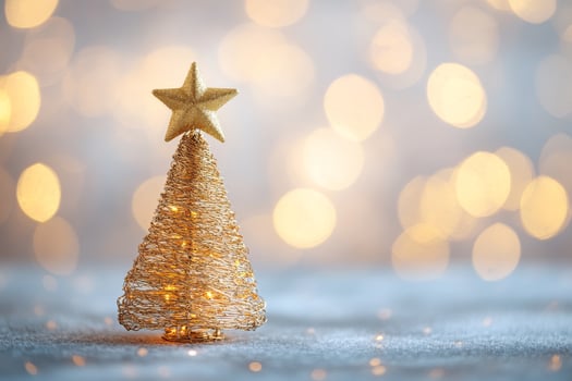 Gold Wire Christmas Tree With a Star Atop Shines in a Festive Atmosphere. photo