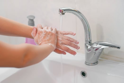 Closeup of a woman washing the hands carefully with soap. The concept of cleanliness and health and the fight against the virus. photo