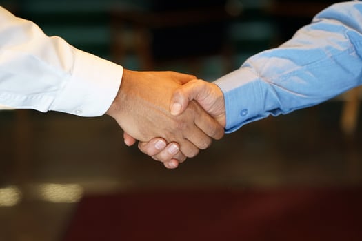 Two business men shaking hands photo