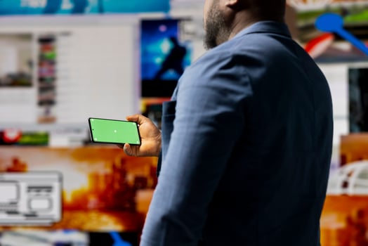 Professional media expert in a high tech space holds green screen, leveraging social media, internet big data and cloud systems. Person engaging followers to boost digital presence. photo