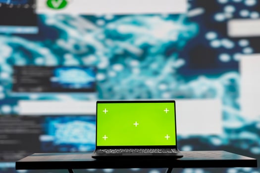 Surrounded by data and neural networks systems, laptop in empty space shows copy space screen for artificial intelligence automation and development. High tech data visualization. photo
