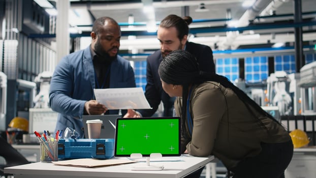 Diverse team members overseeing factory activity next to copy space, blending professionalism and technical expertise in the world of sustainable industrial energy. Cheaper power. Camera A. photo