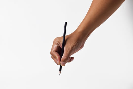 Asian man holding pencil in hand with isolated background photo