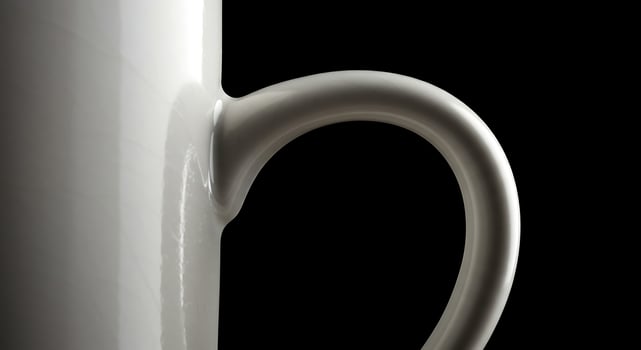 White Ceramic Mug Handle CloseUp on Black. photo