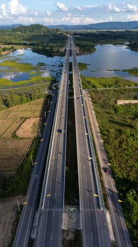 Aerial view of the long bridge build for crossing Nong Luang the largest lake in Wiang Chai district of Chiang Rai province of Thailand. photo