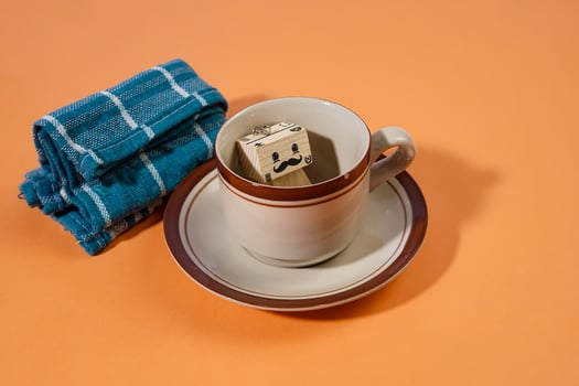 Creative Still Life with a Coffee Cup and a Sugar Cube Character photo