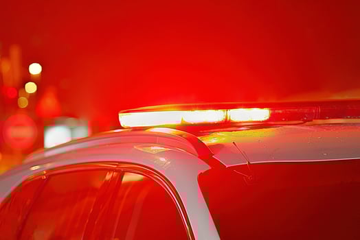 Red lights on top of police car. Night time. photo