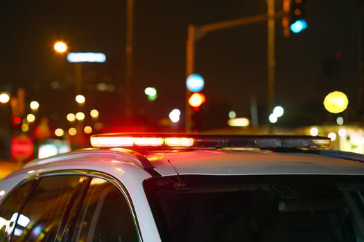 Red lights on top of police car at night. photo