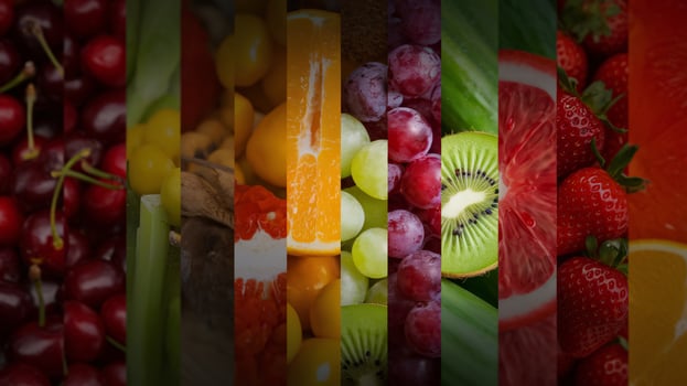 Colorful assortment of fresh fruits including cherries, grapes, and kiwi, arranged beautifully. photo