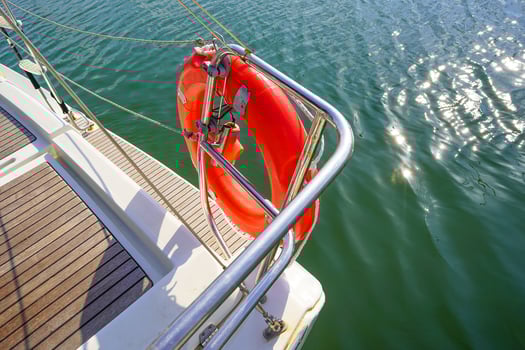 Lifebuoy aboard a yacht. Concept of water tourism. Sailing a yacht. photo