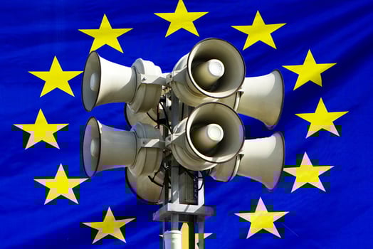 Flag of European Union. Loudspeaker on EU flag background photo