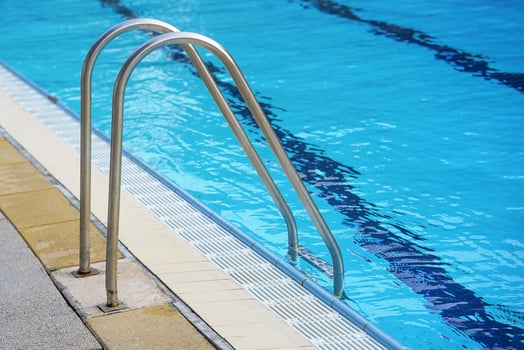 Handrails for descent into the empty pool photo