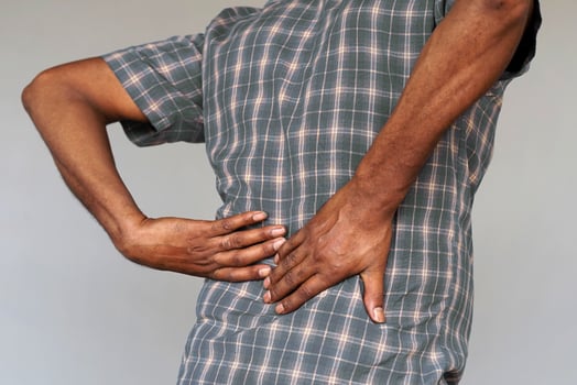 Man with low back pain. Kidneys pain, urolithiasis disease. Pain in kidneys. Kidney stones photo