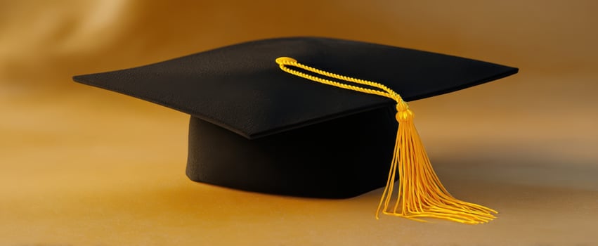 The graduation cap with a gold tassel on a seamless background. photo