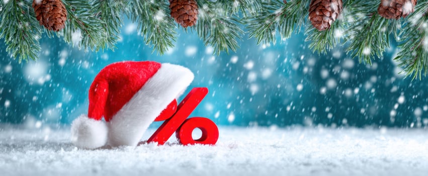 The festive Christmas hat with a discount percentage symbol in a snowy setting. photo