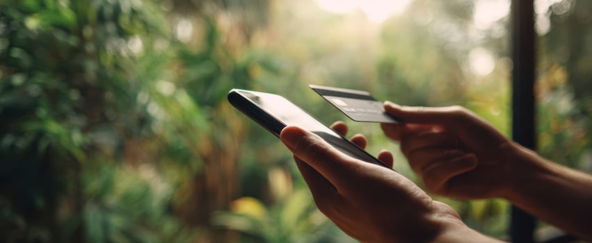 The smartphone and credit card in a modern online shopping interaction. photo